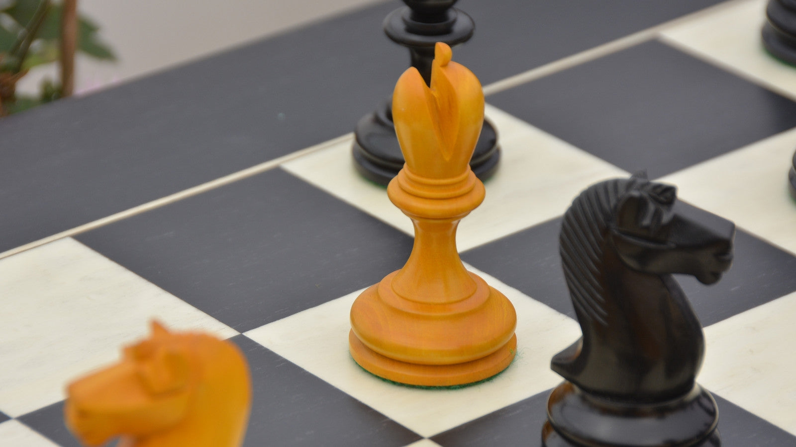 Repro B & Co 1860s Antique Pieces in Ebony / Antiqued Boxwood - 4" King With Maple Chess Board